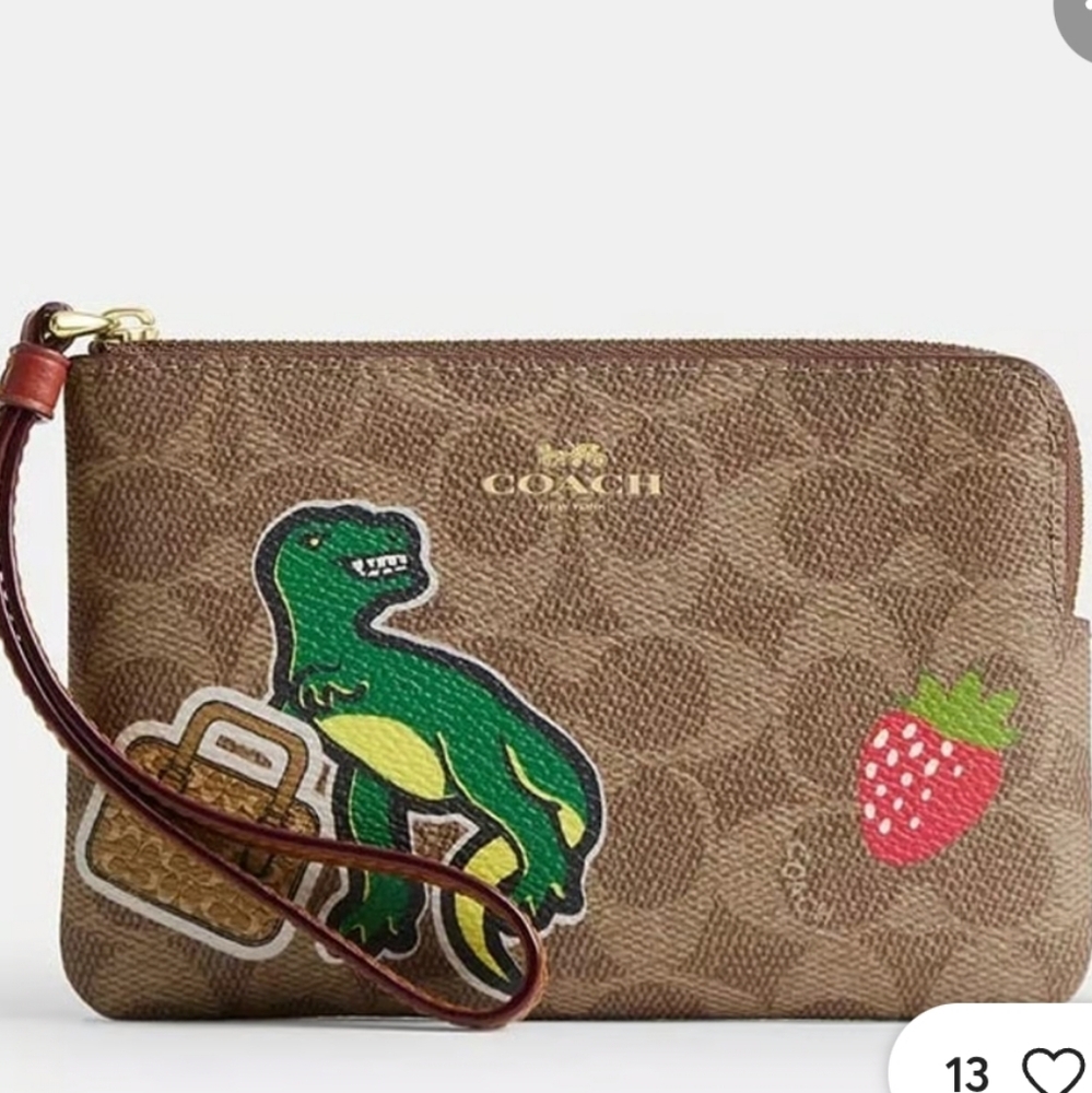 Coach Tan Canvas Wristlet with Dinosaur and Strawberry Sticker Print